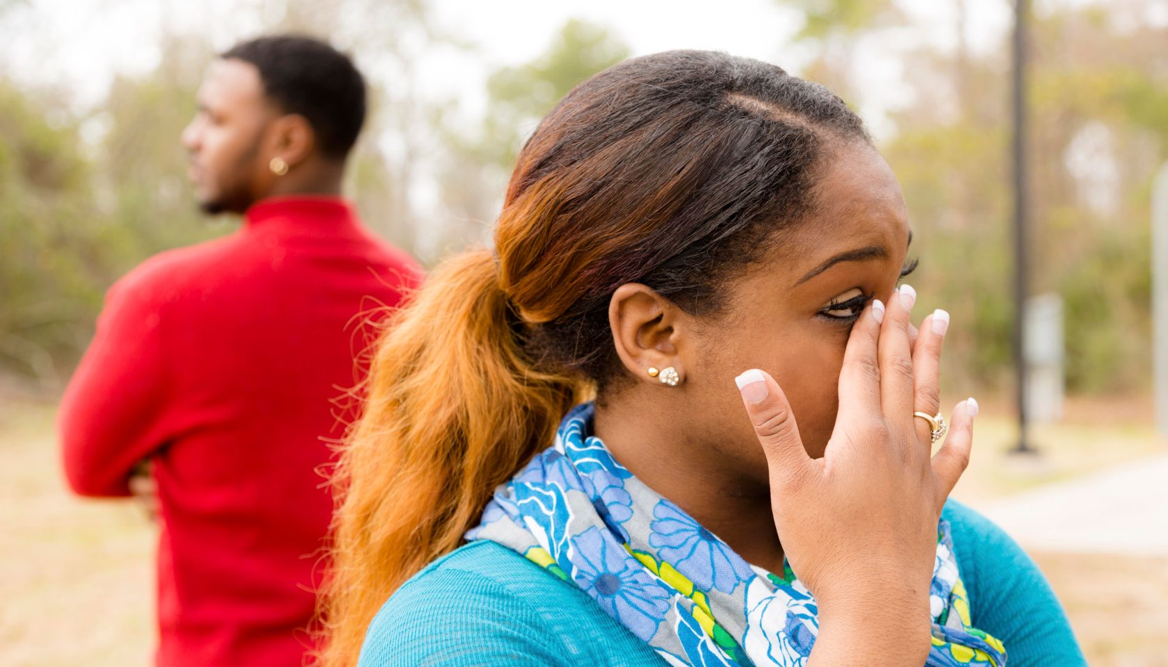 Conflict, arguement between African descent couple. Sadness, crying, anger.