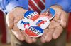 Holding political campaign buttons