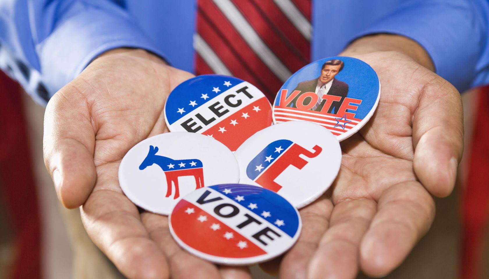 Holding political campaign buttons