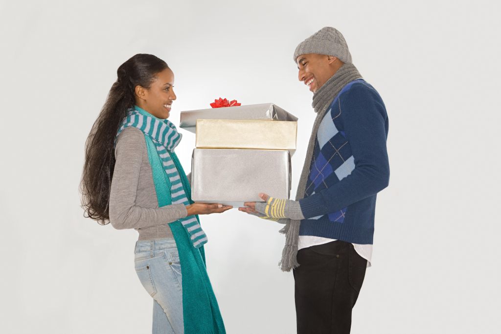Couple holding christmas gifts