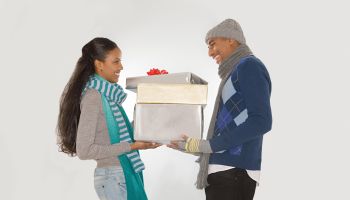Couple holding christmas gifts