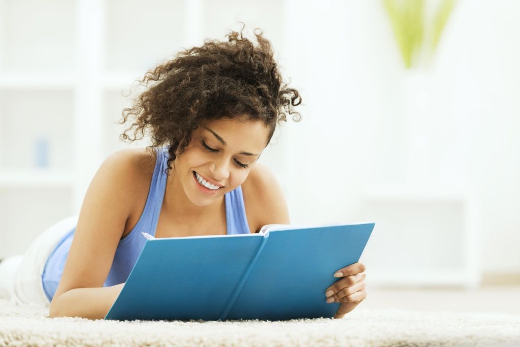 Young woman writing a diary.