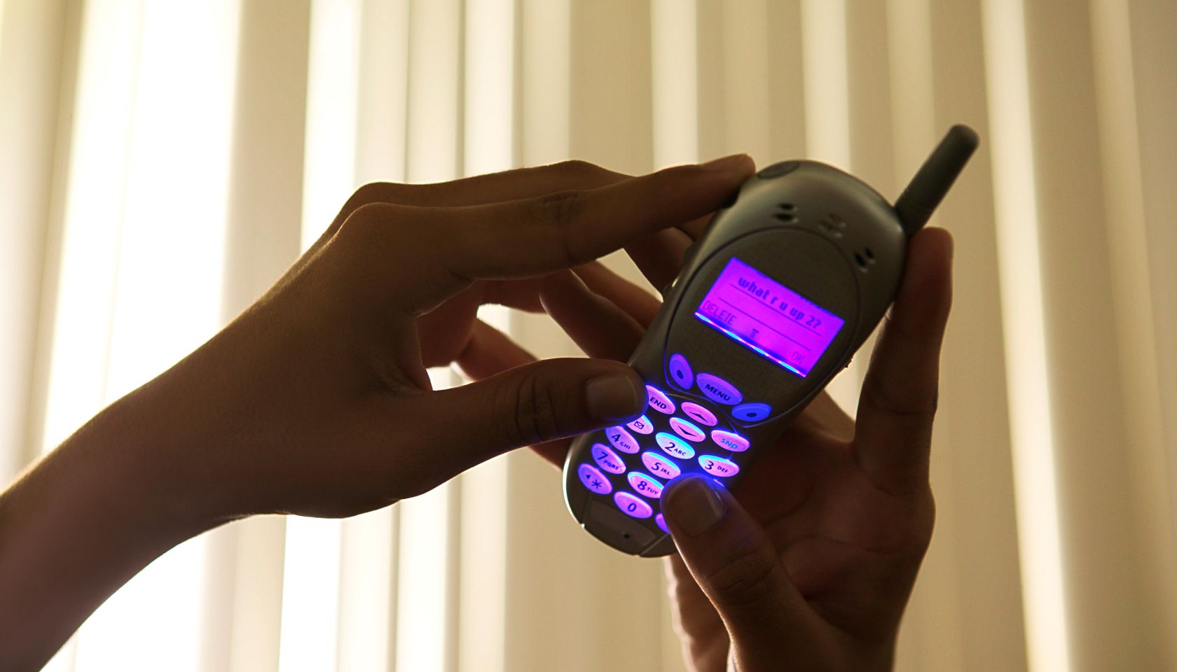 Hands using cell phone