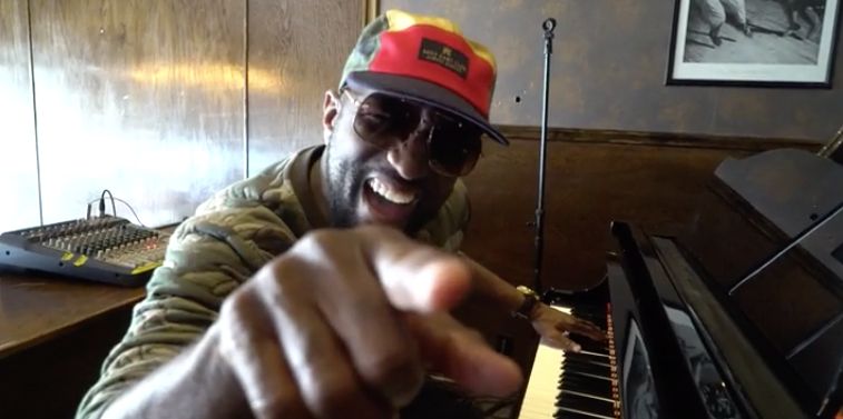 Rickey Smiley playing the piano.