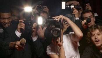 Paparazzi photographers and television reporters at celebrity event