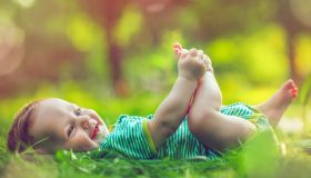 Cute baby outdoors in summer