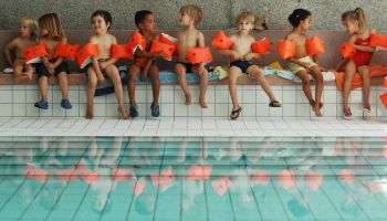 Germany Berlin Mitte - indoor swimming pool on Fischerinsel (fisher island), children with water wings