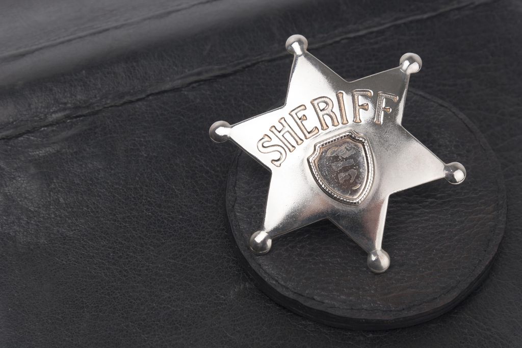 Sheriff's badge on dark background