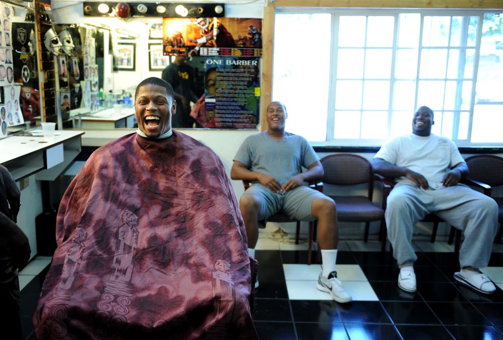 homeless black man laughing