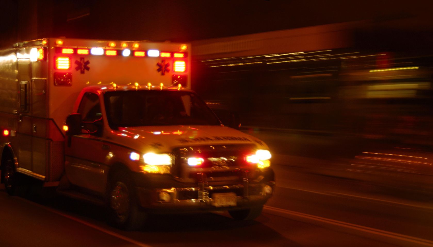 Ambulance at night, speeding