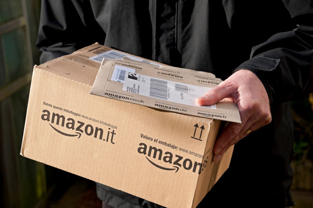 A Man Holding an Amazon Delivery