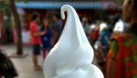 Close-Up Of Ice Cream Cone With People In Background