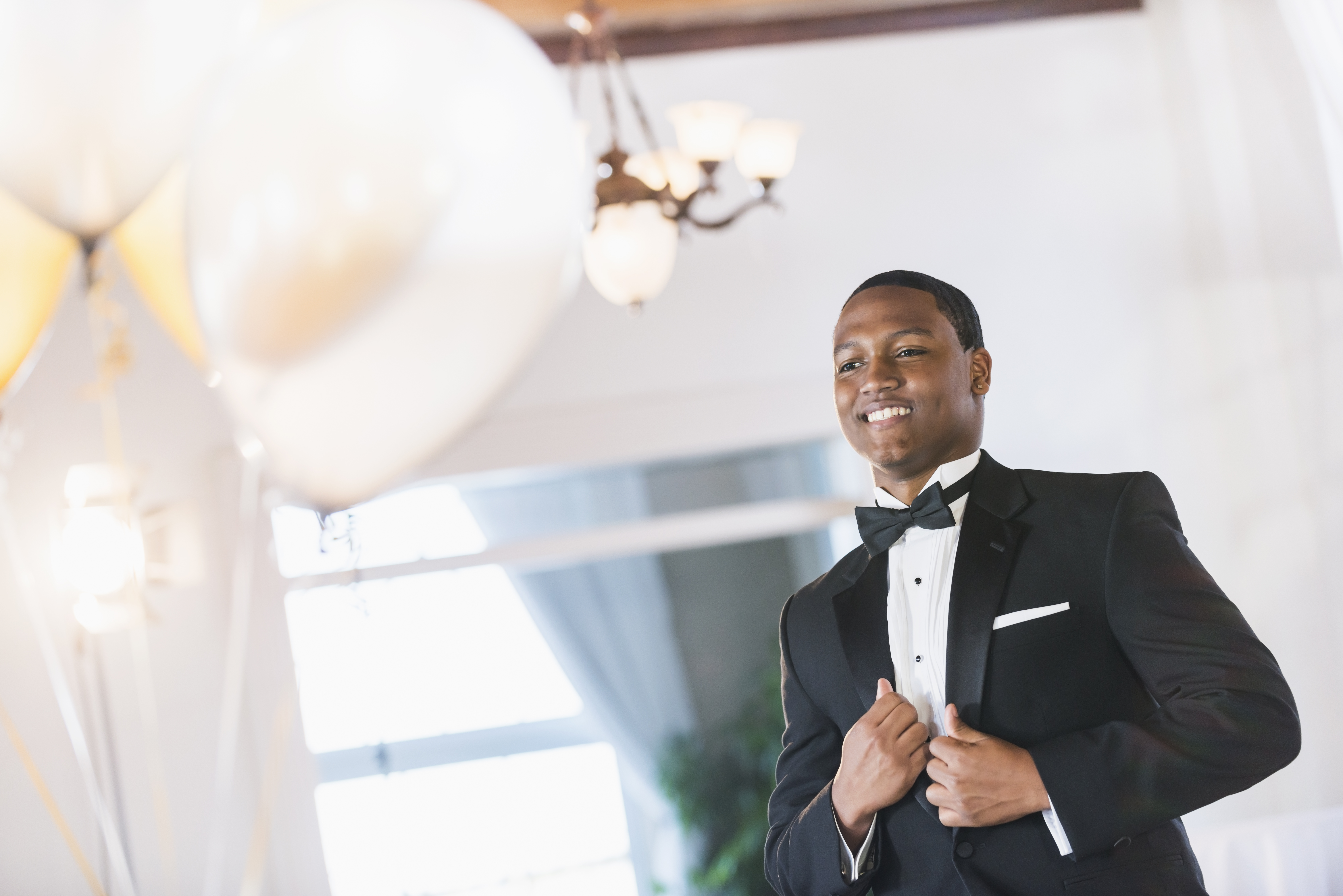 Young black Hispanic man wearing tuxedo