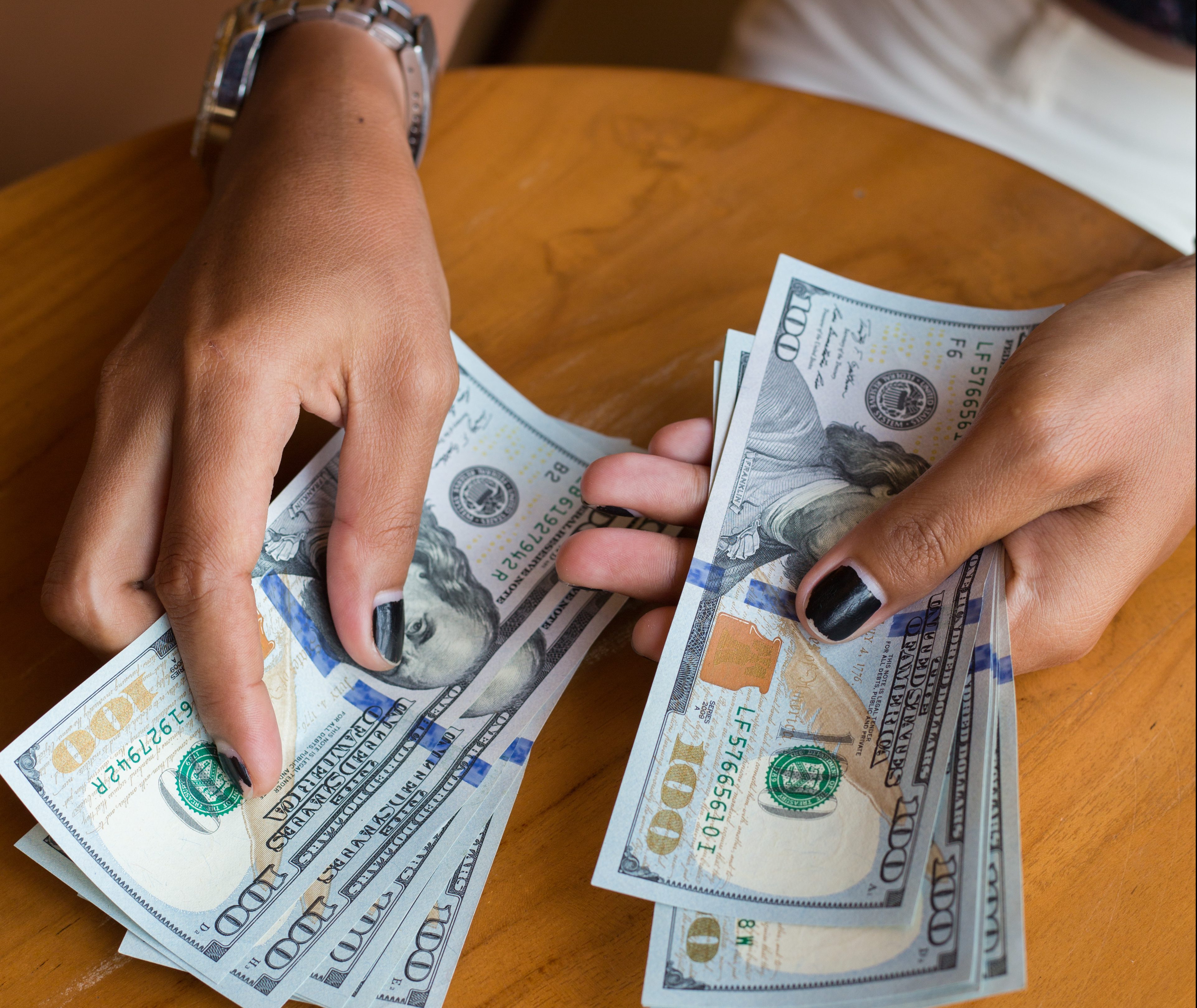 Close-Up Of Woman Holding Money