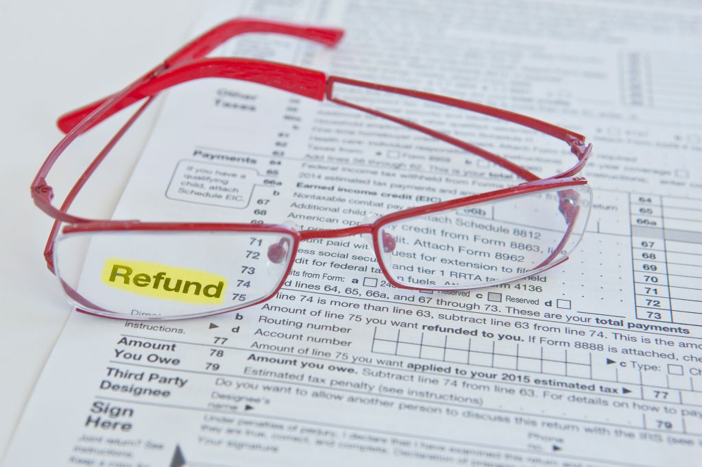 Tax form and eyeglasses