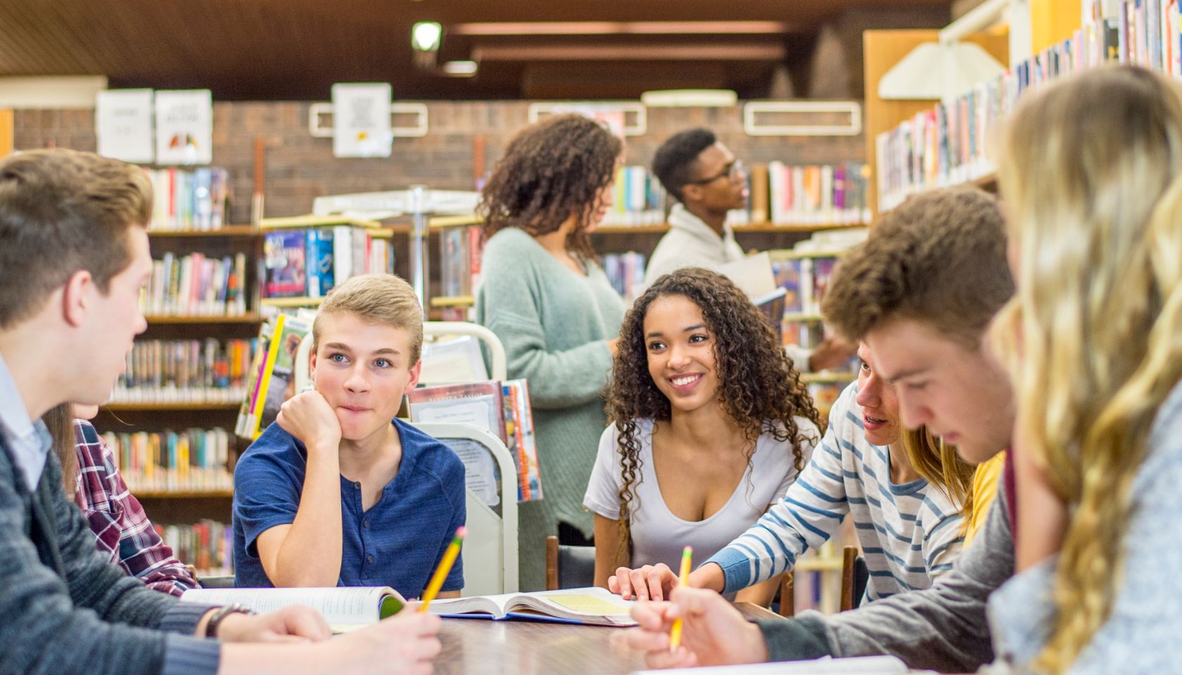 Teens Hanging Out In Library