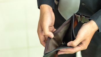 Midsection Of Man Showing Empty Wallet