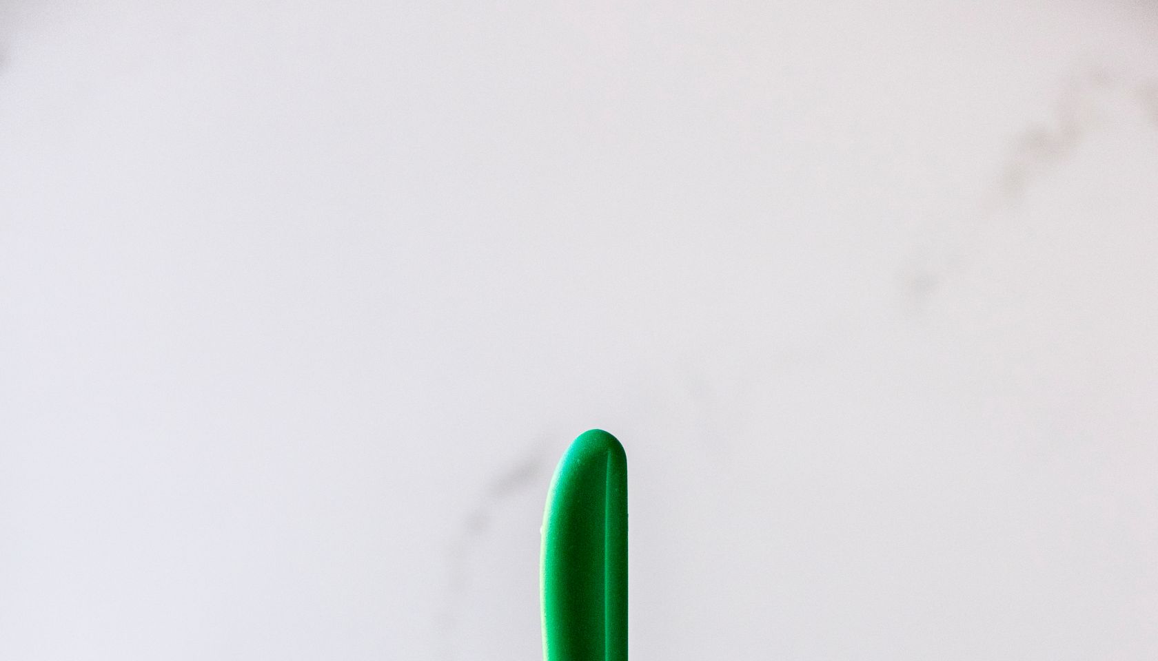 Close-Up Of Kitchen Knife In Butter On Table