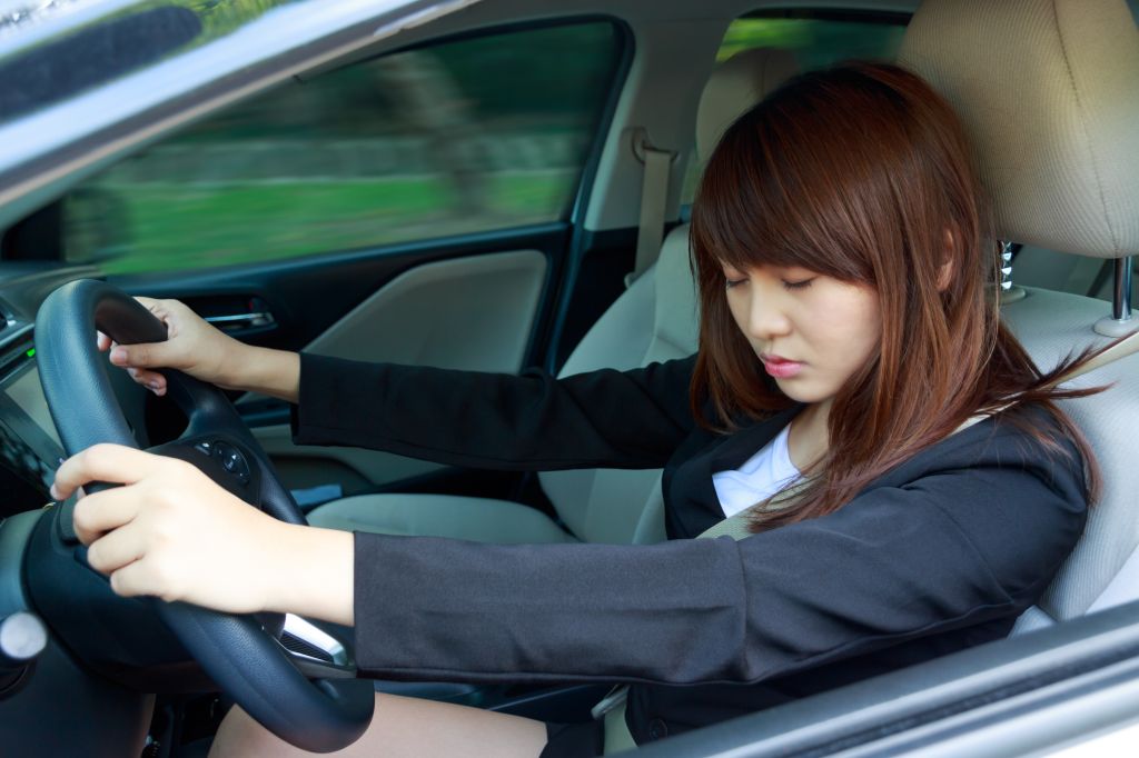 Businesswoman Napping While Driving Car