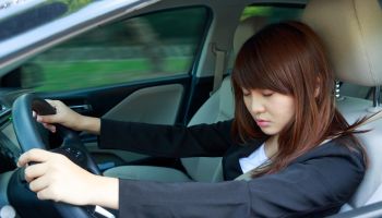 Businesswoman Napping While Driving Car