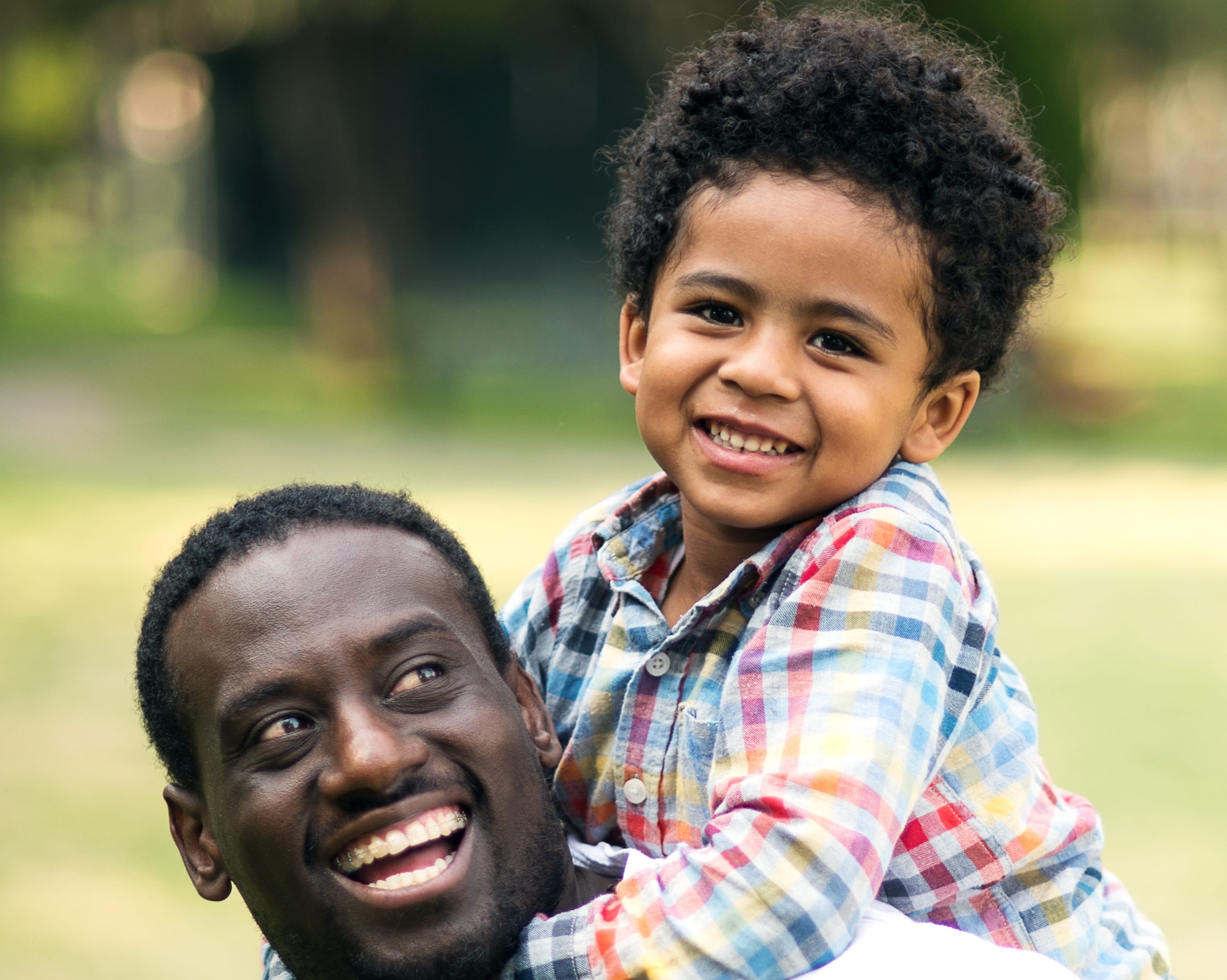 Portrait of a smiling father and son.