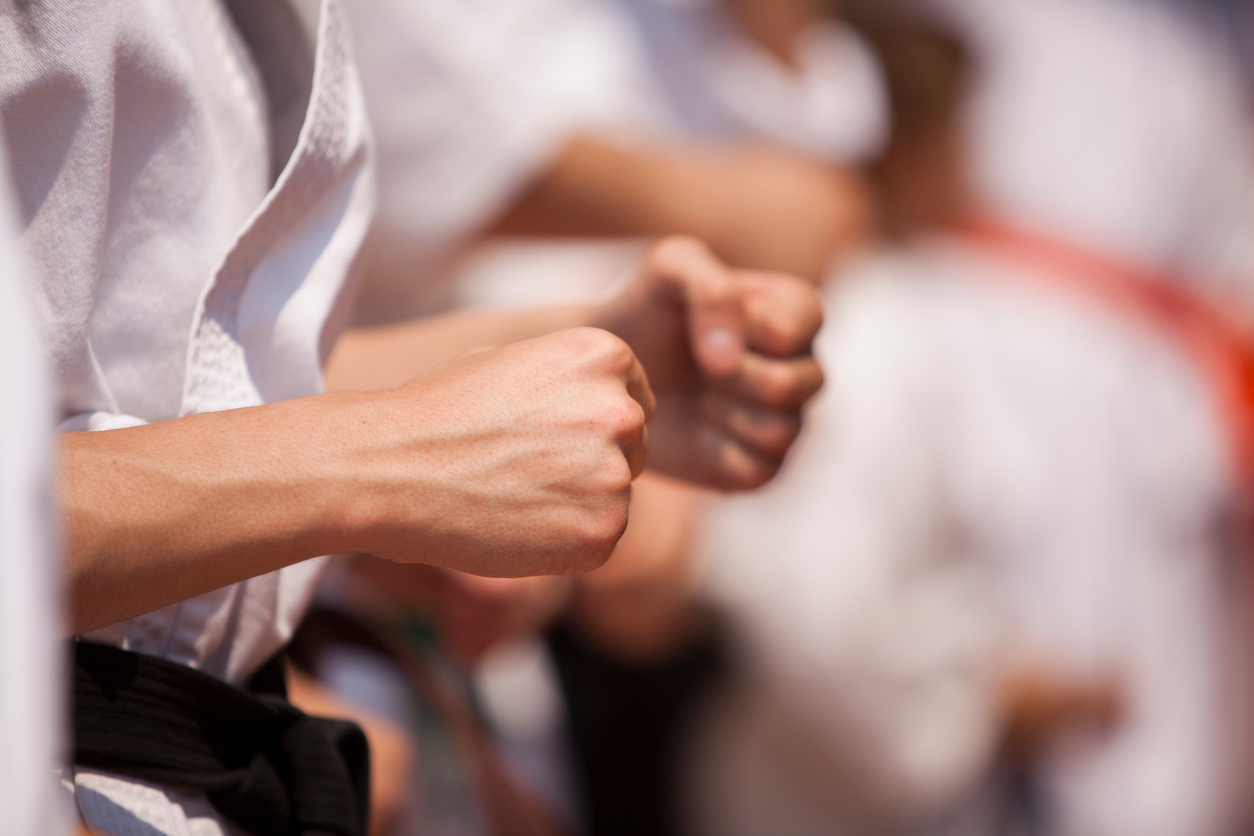 Midsection Of Child Practicing Karate