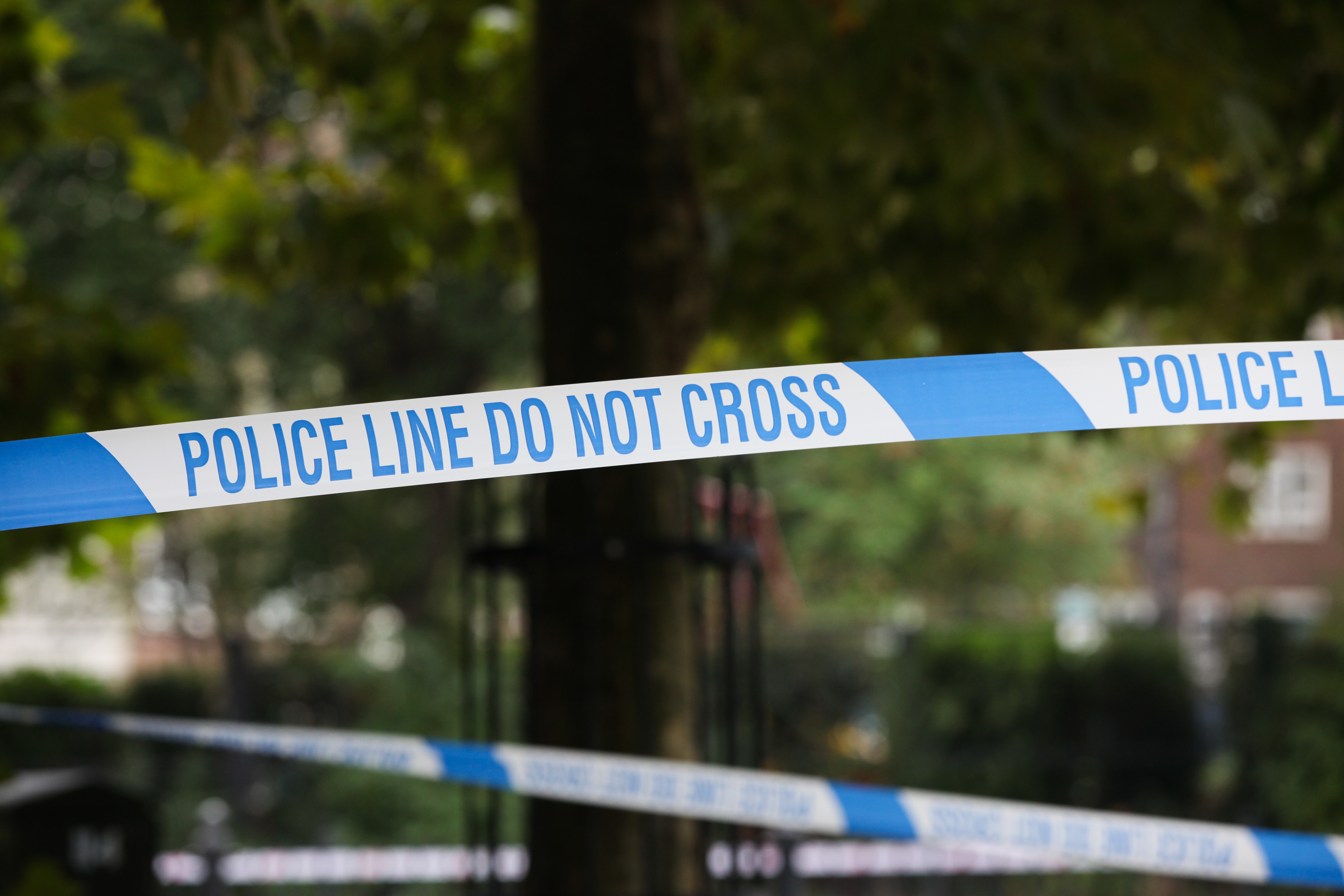 Cordons remain in place at the scene of a shooting in Haringey, north London, that left a man in his 20s fighting for his life in hospital