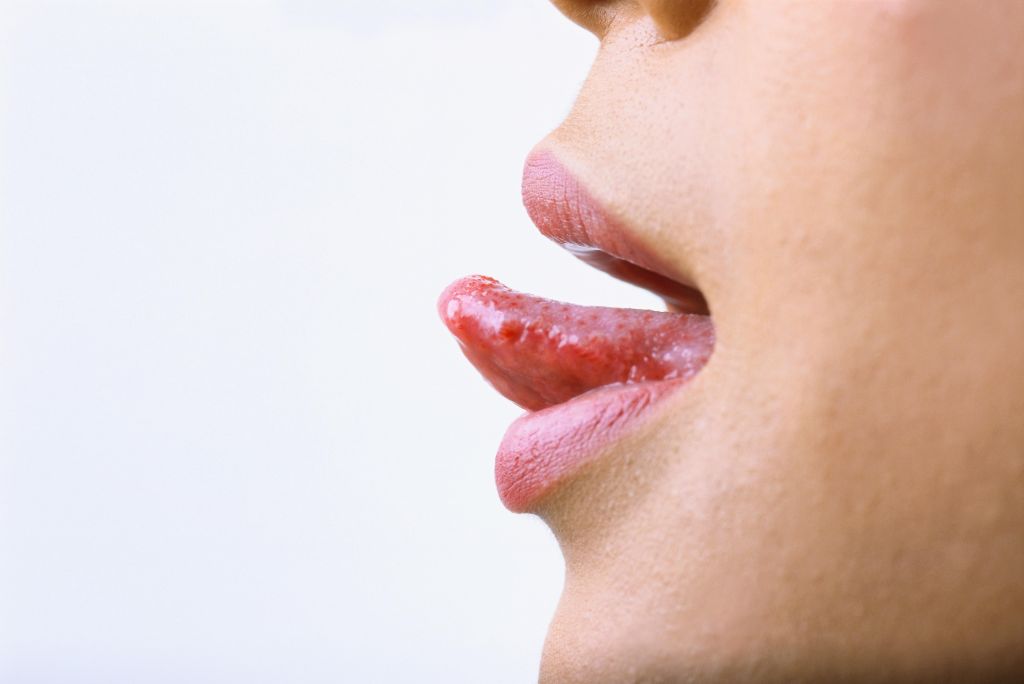 close-up of a woman sticking her tongue out