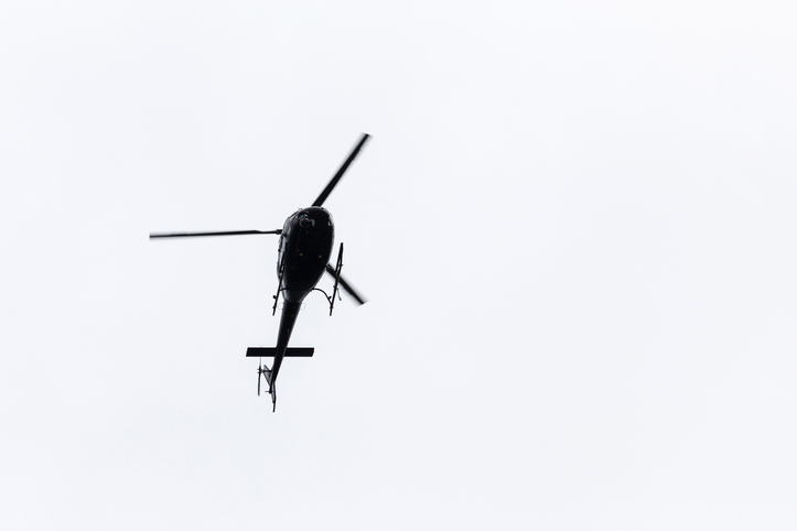 Low Angle View Of Helicopter Flying Against Clear Sky