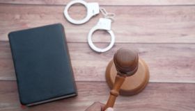 gavel, handcuff and law book