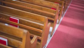 High Angle View Of Pews By Aisle At Church