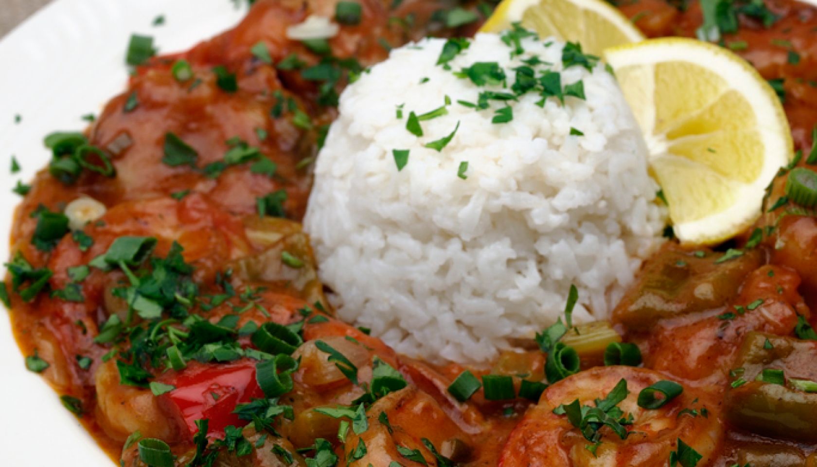 Shrimp dish with white rice on a white plate