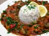 Shrimp dish with white rice on a white plate