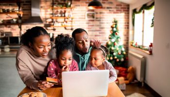 Young family online Christmas shopping