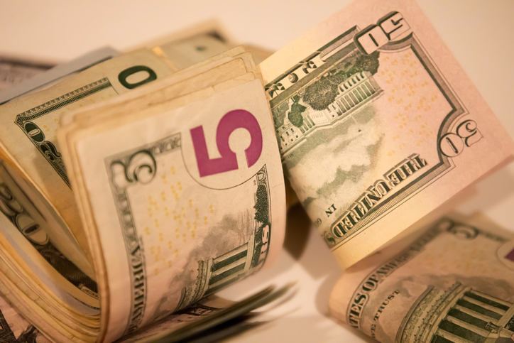 wads of various denominations of u.s. paper bills