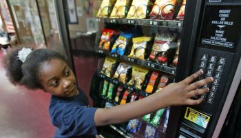 (052907 Somerville, MA) 8 year old Toni Crutchfield of Somerville makes a healthy choice in one of the vending machines at the Somerville Girls & Boys Club Tuesday, May 29, 2007. Staff photo by Matt Stone