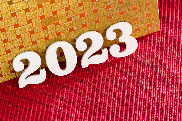 Happy new year 2023 - White wooden letters on red background
