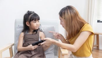 Upset Asian Mother Grab Mobile Phone From Her Kid to Stop Her Daughter From Game Addiction