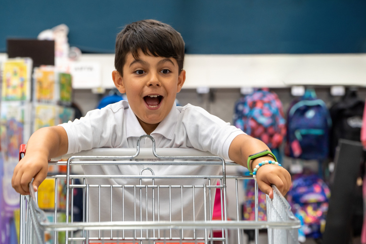 happy kid with shopping cart